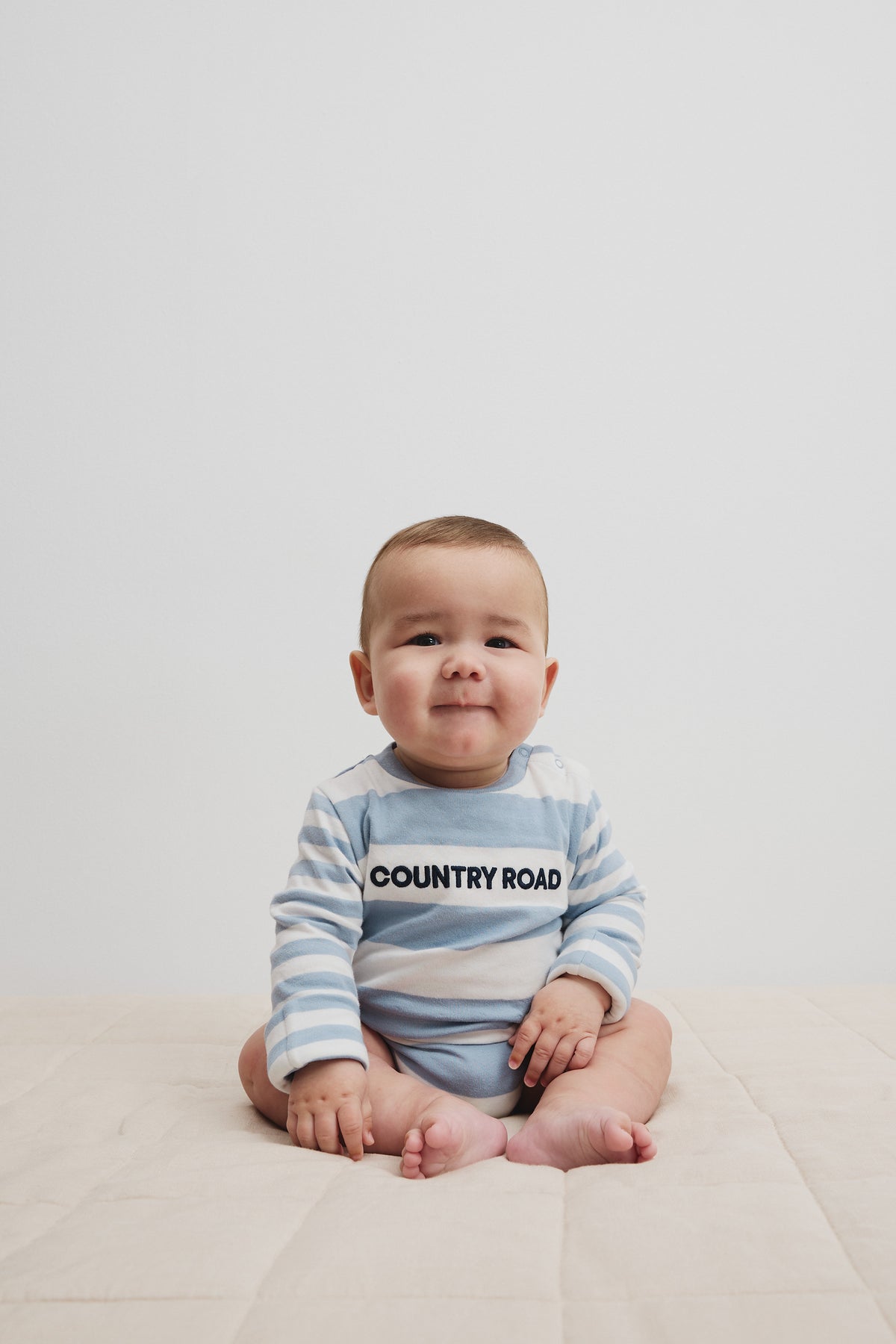 Spliced Stripe Long Sleeve Bodysuit